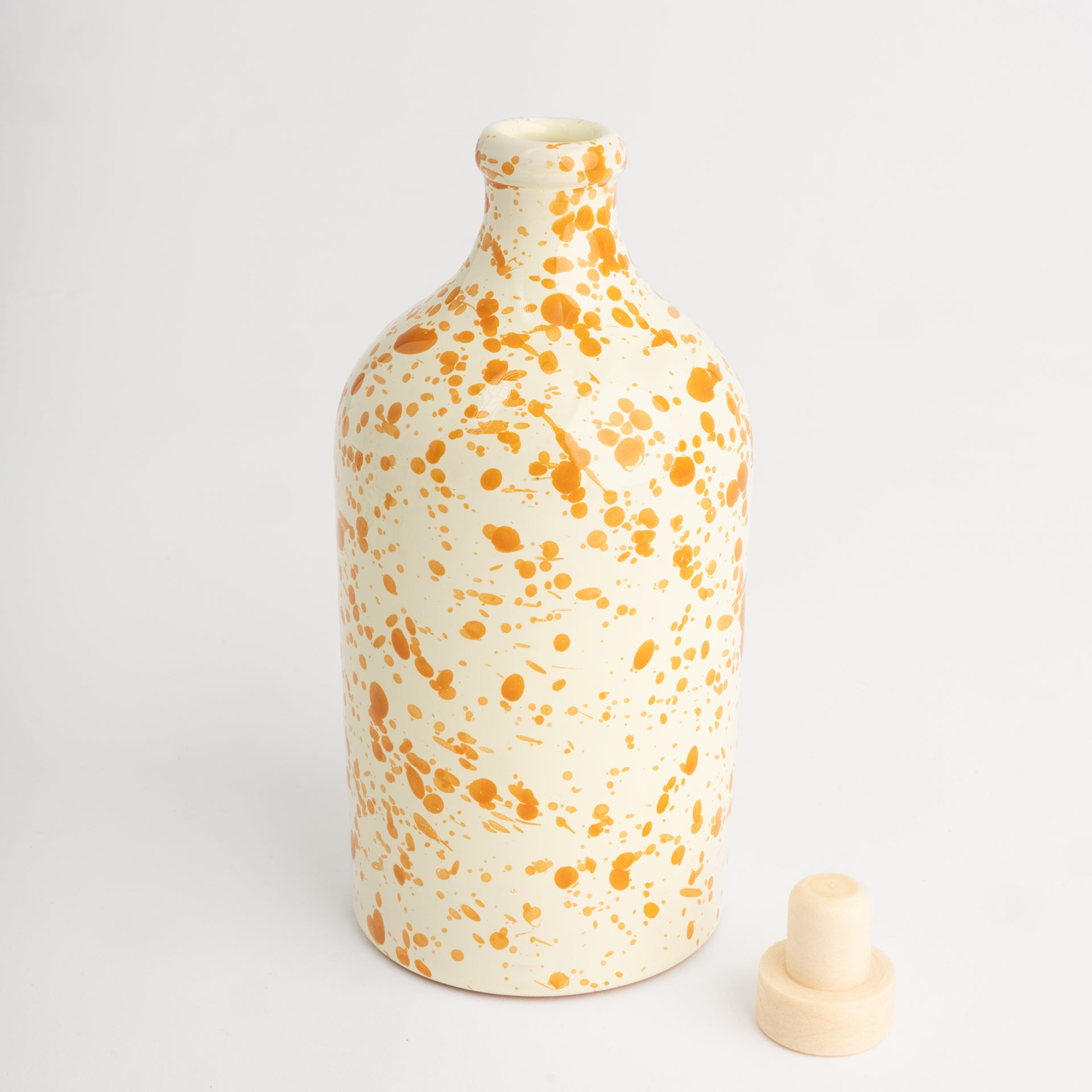 Orange splatter oil bottle