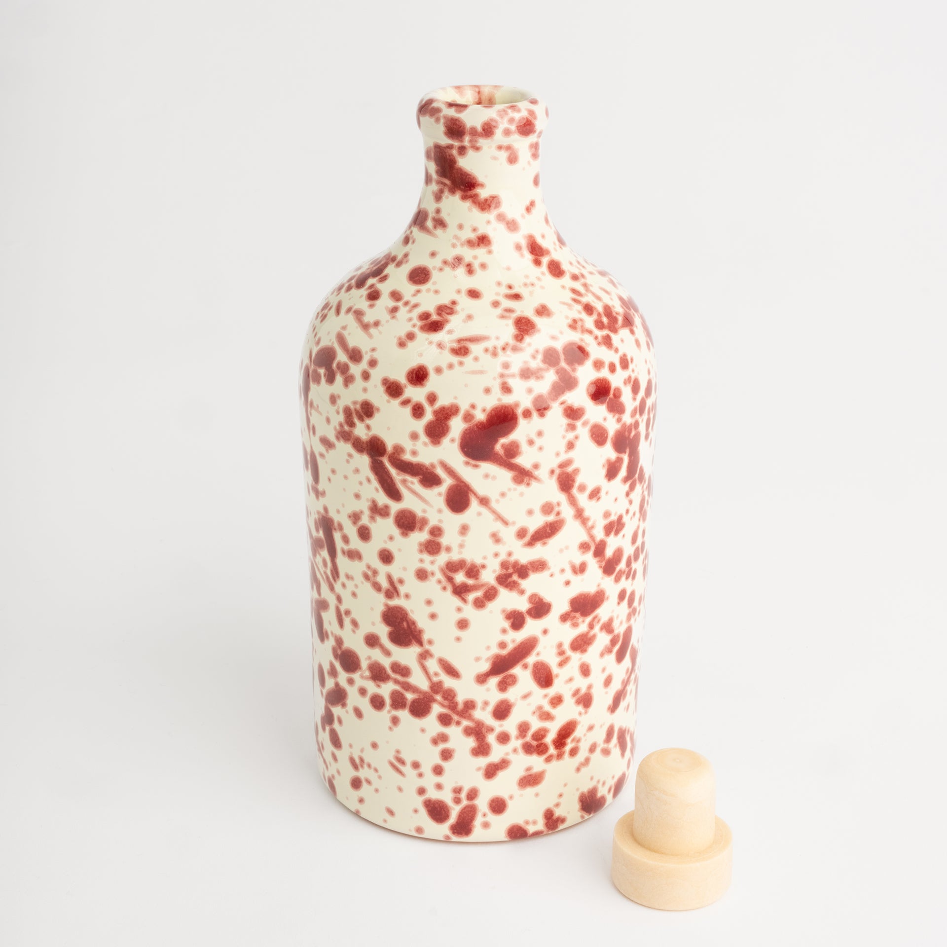 Red splatter oil bottle