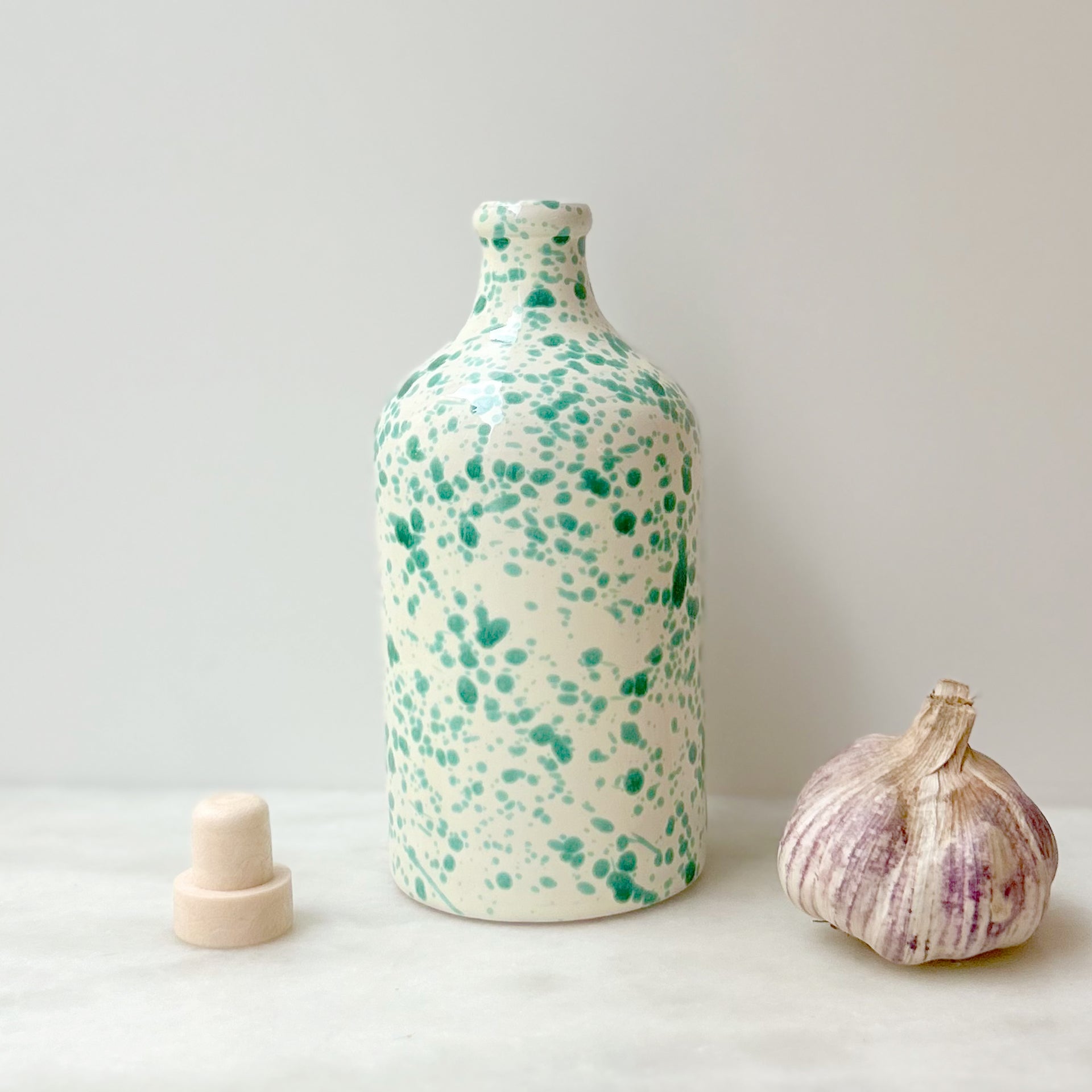 Green splatter oil bottle