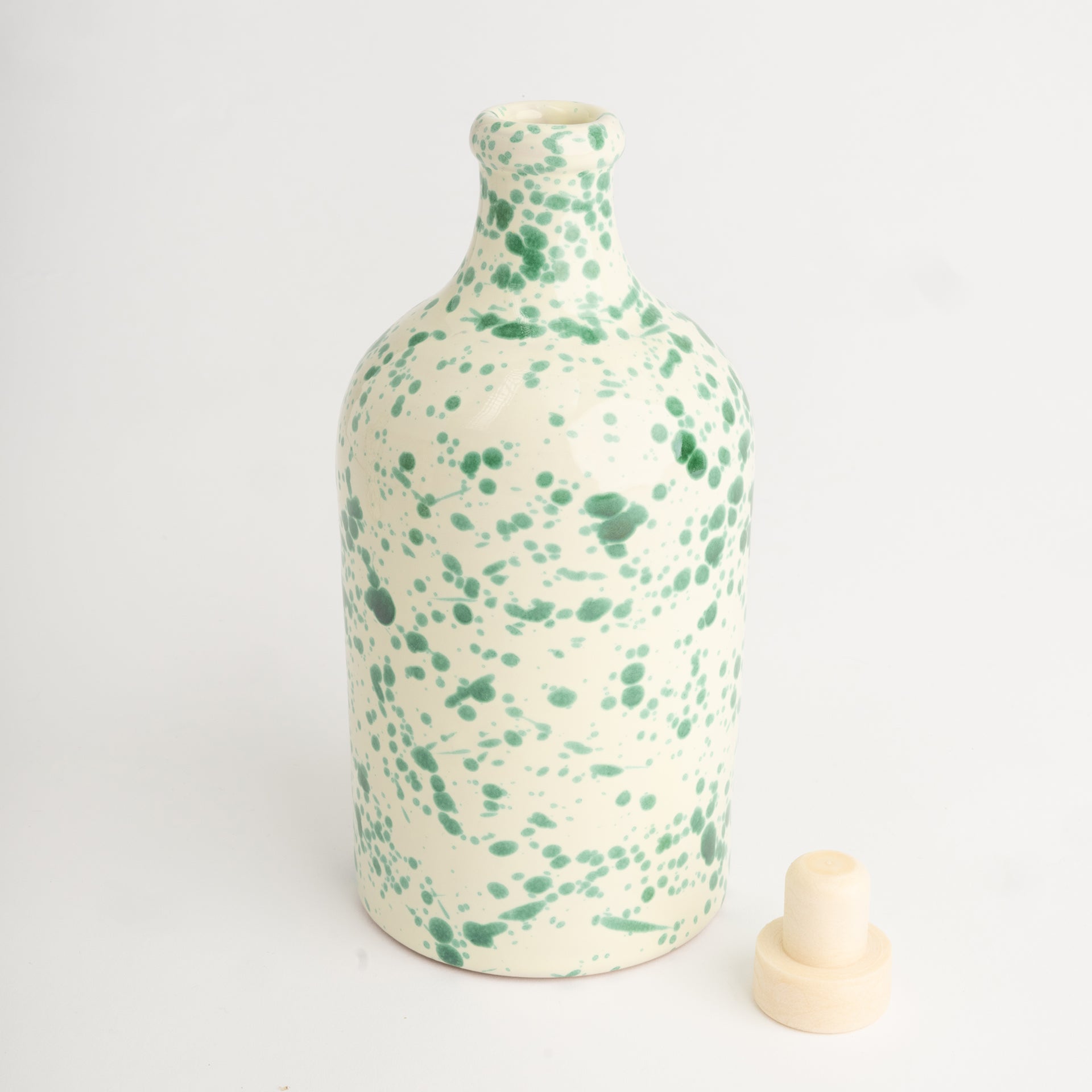 Green splatter oil bottle